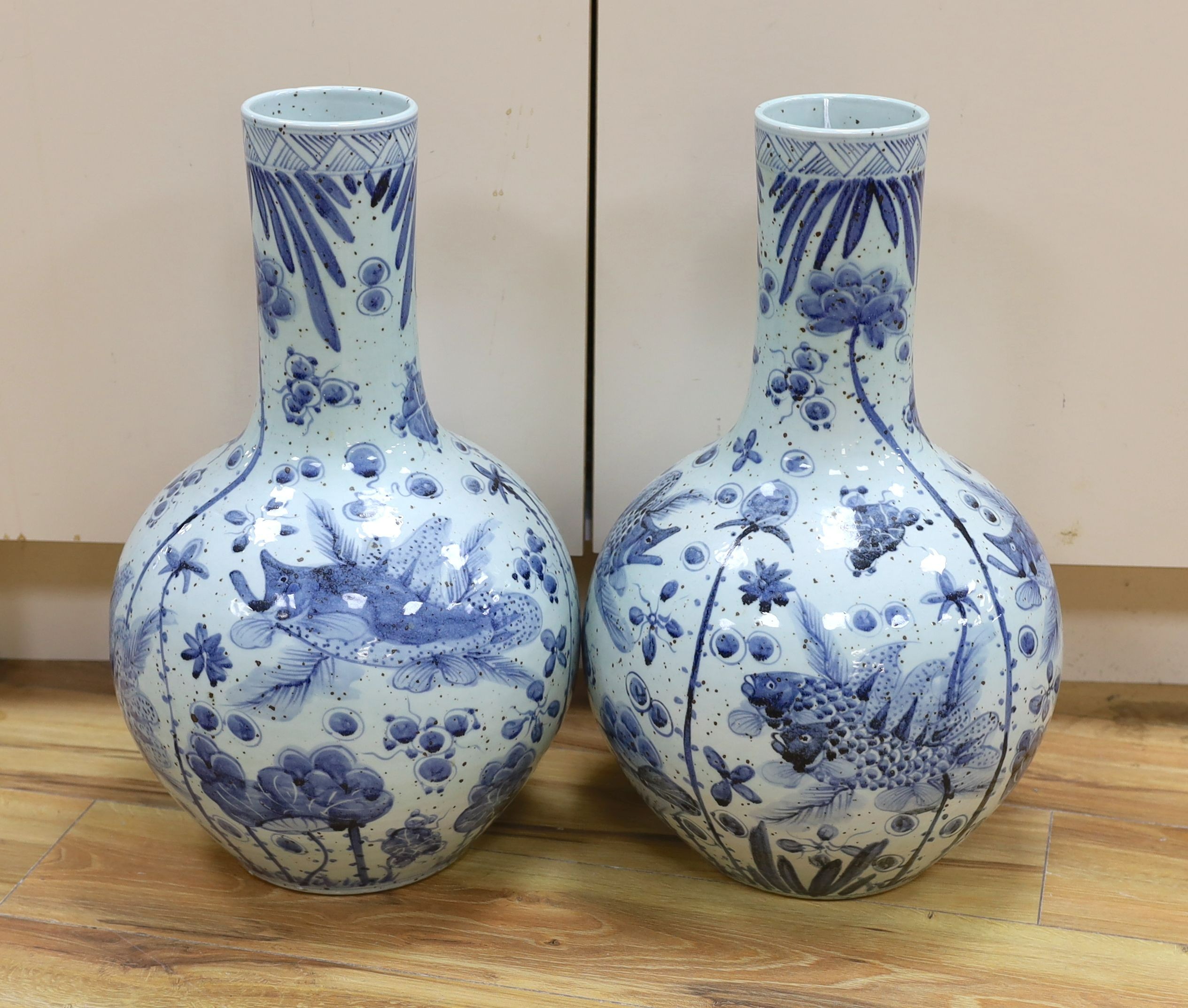 A pair of large Chinese vases, coy carp and floral, 56cms high.